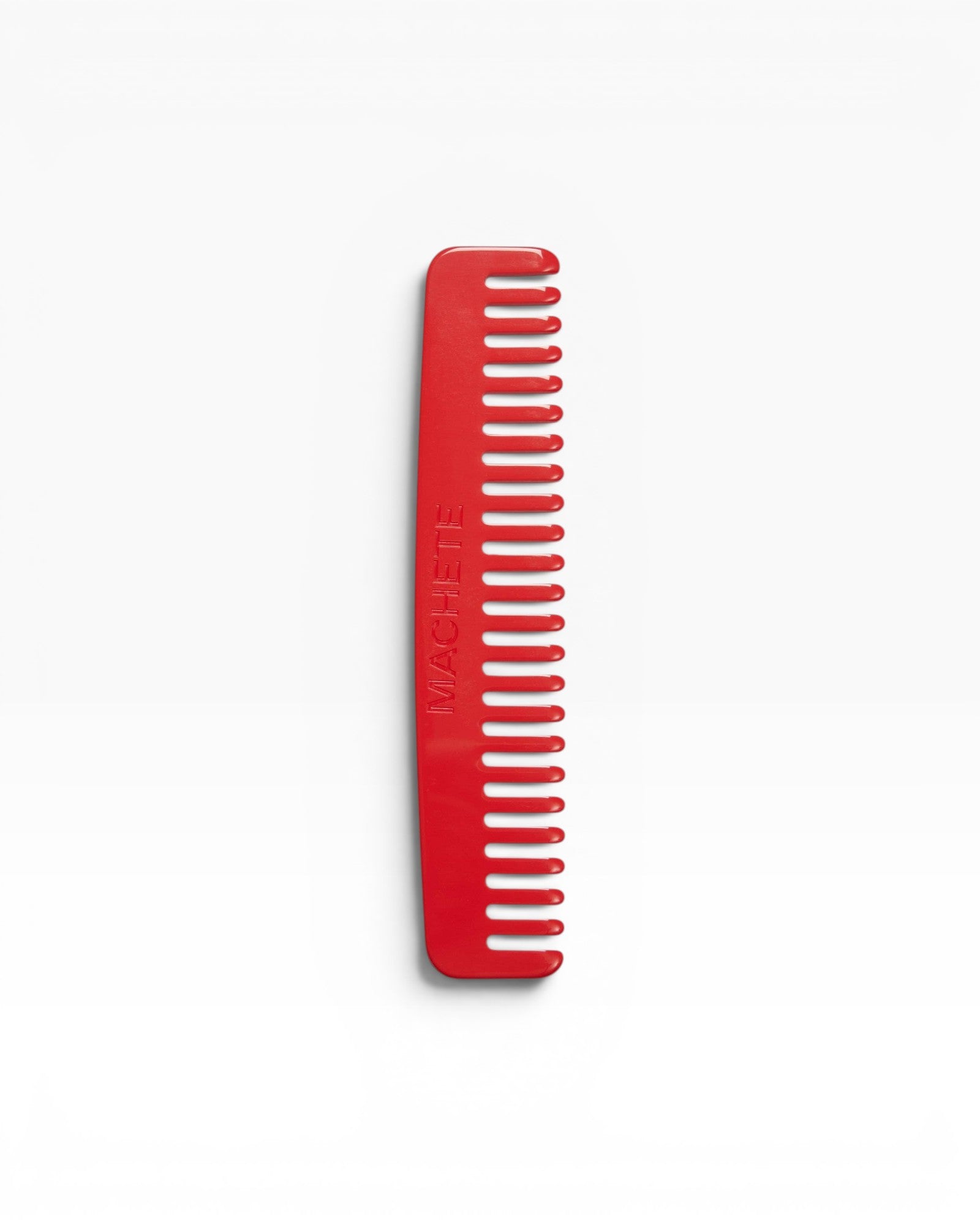JONES + CO No. 3 Comb in Ruby red, a compact wide-tooth travel comb handcrafted from Italian bio-acetate.
