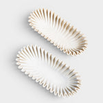 JONES + CO Ruffle Marble Oval Bowl, hand-carved natural marble with scalloped edges and organic silhouette. White.