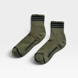 JONES + CO Le Bon Shoppe Girlfriend crew socks in sage green with navy blue varsity stripes and logo detail