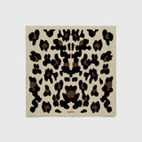 JONES + CO Sahara Scarf in sand featuring a black and brown leopard print pattern on matte silk crêpe de Chine.