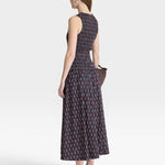 JONES + CO Siempre Tank Maxi dress with block print polka dot pattern, smocked bodice, and flowing skirt.