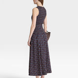 JONES + CO Siempre Tank Maxi dress with block print polka dot pattern, smocked bodice, and flowing skirt.