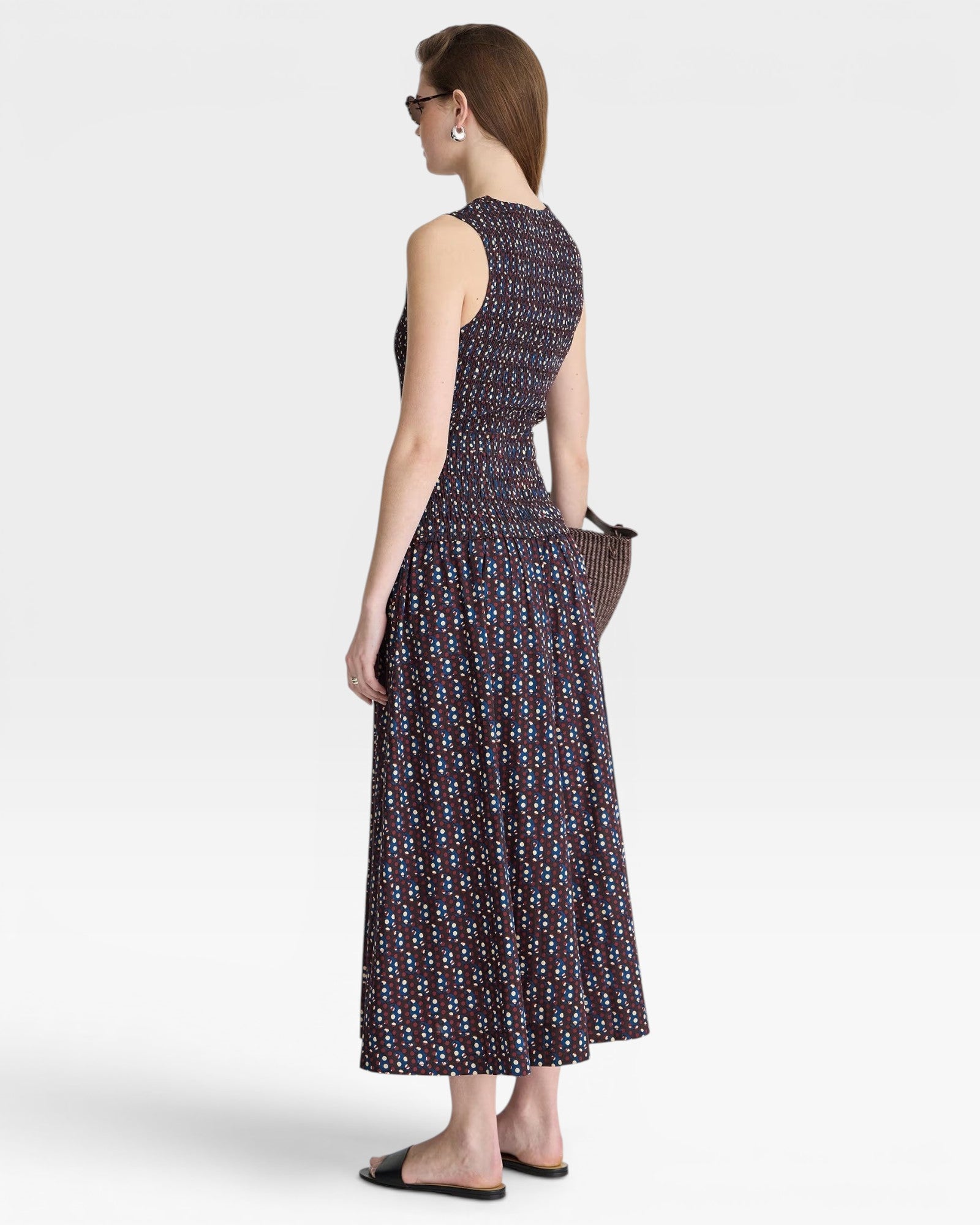 JONES + CO Siempre Tank Maxi dress with block print polka dot pattern, smocked bodice, and flowing skirt.