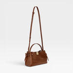 JONES + CO Gyoza Mini bag in Sierra brown embossed Italian leather with gold-tone hardware and top handle.