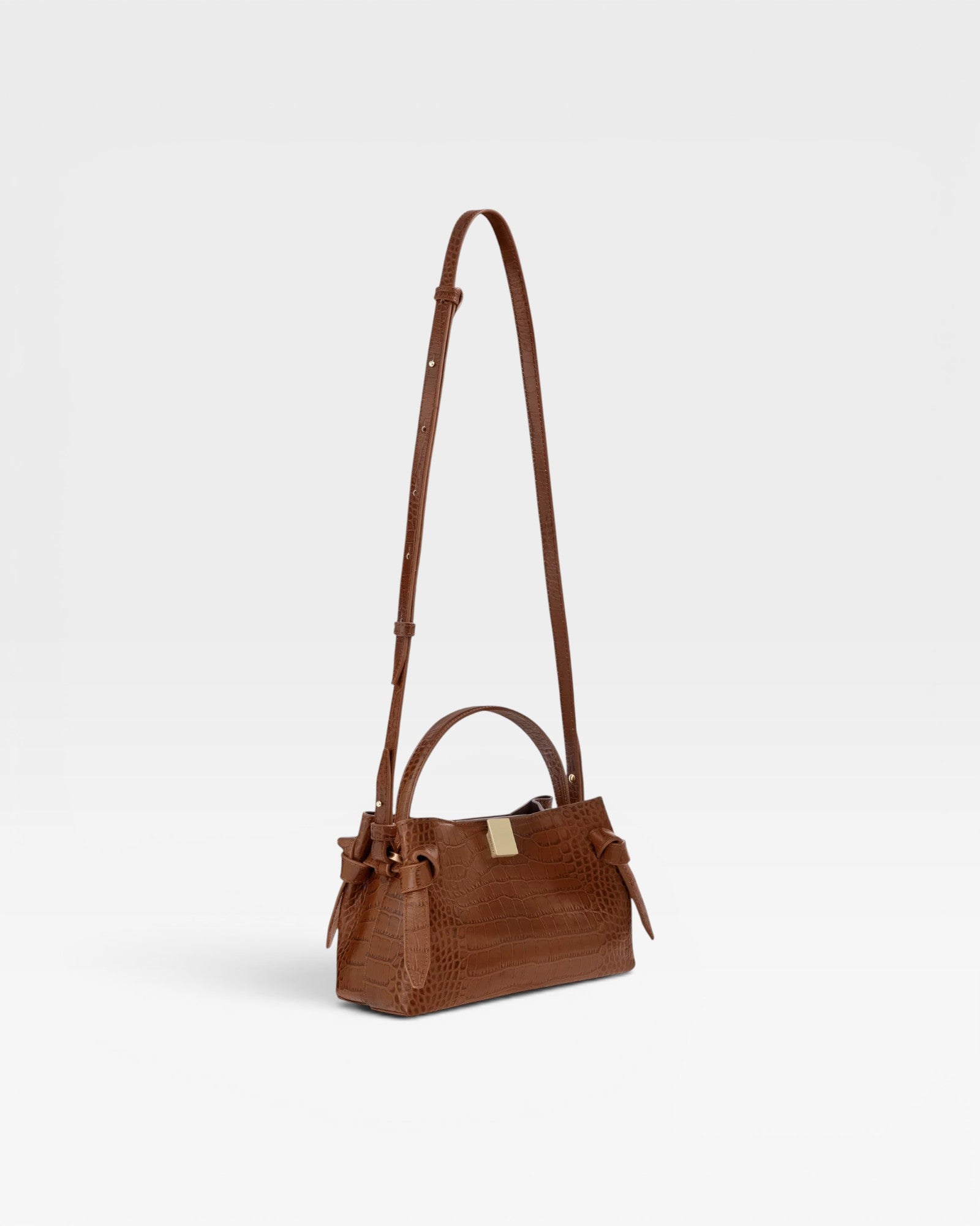 JONES + CO Gyoza Mini bag in Sierra brown embossed Italian leather with gold-tone hardware and top handle.