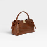 JONES + CO Gyoza Mini handbag in Sierra brown embossed Italian leather with gold-tone hardware and top handle.