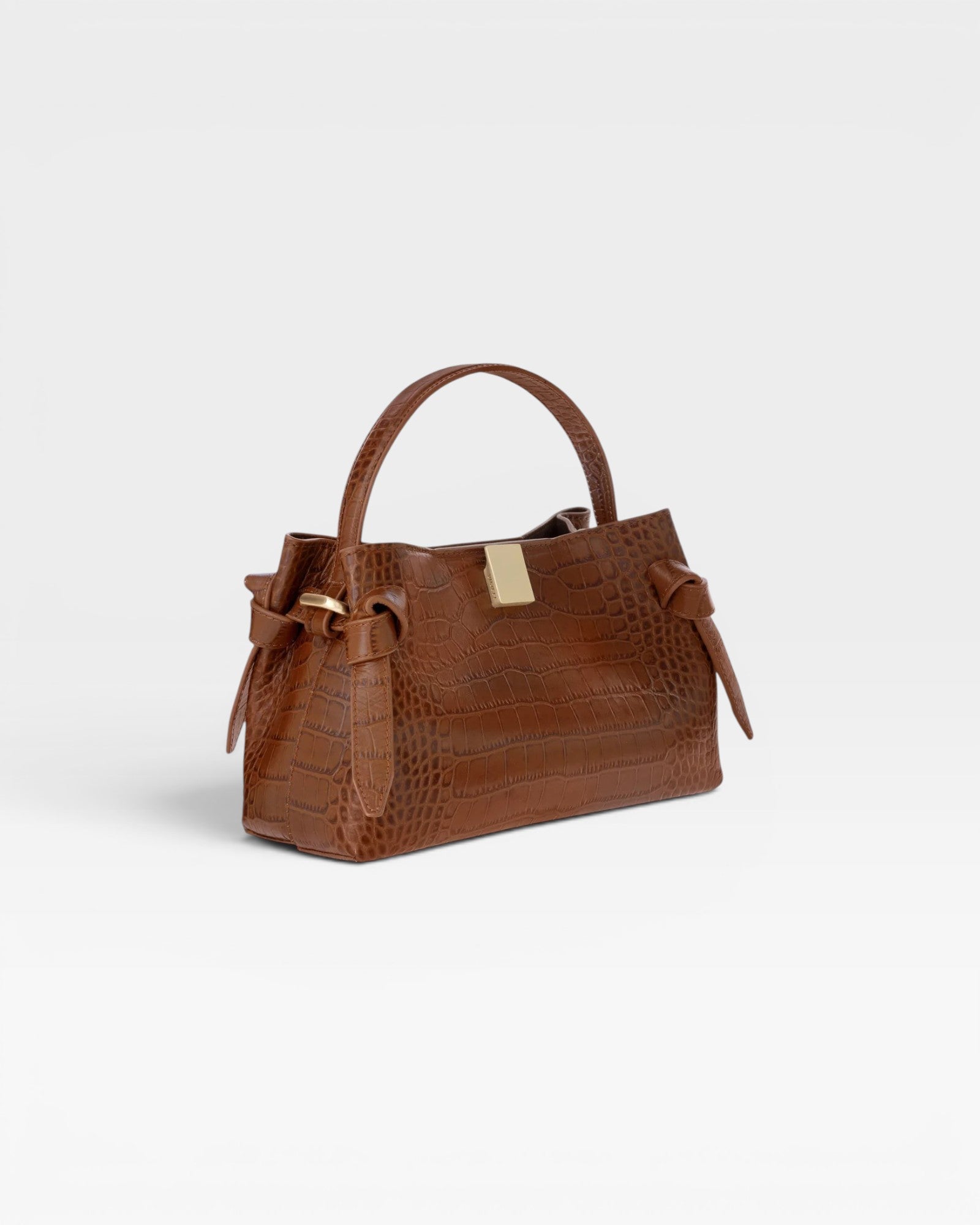 JONES + CO Gyoza Mini handbag in Sierra brown embossed Italian leather with gold-tone hardware and top handle.