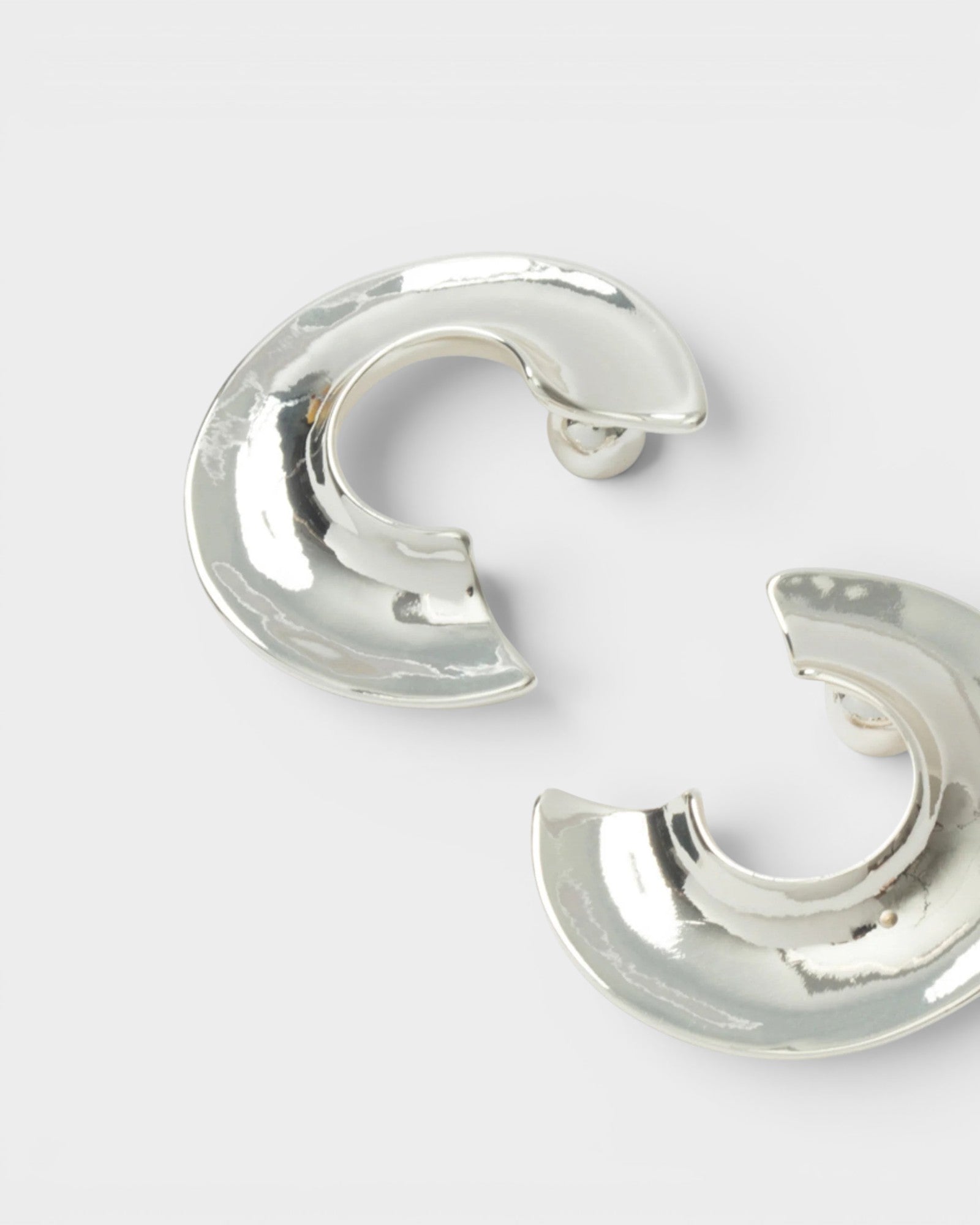 JONES + CO chunky silver-plated brass Rail hoop earrings with a carved three-quarter design and post fastening.
