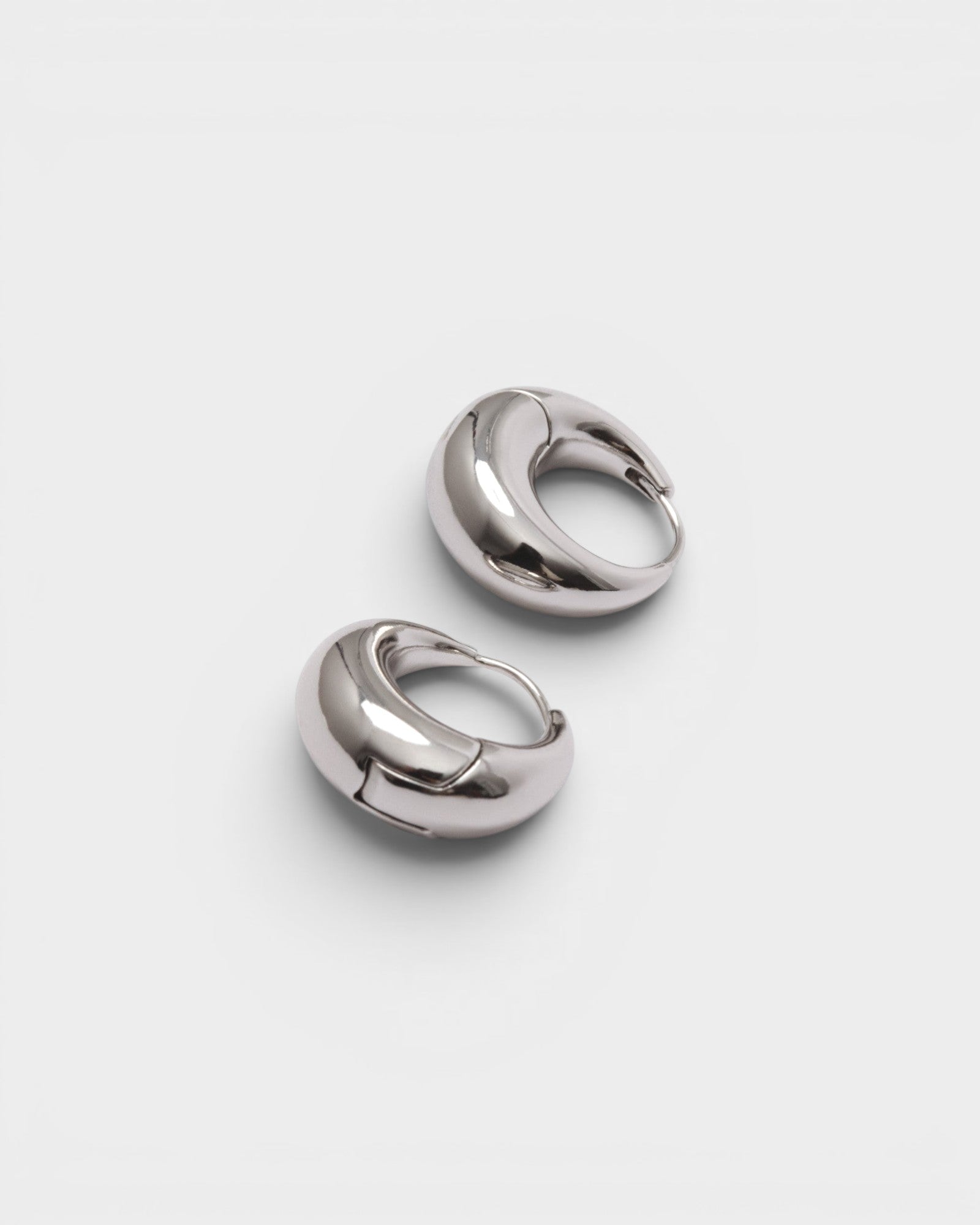 JONES + CO Alpha Hoop silver-plated brass chunky tapered huggie earrings with hinge detail.