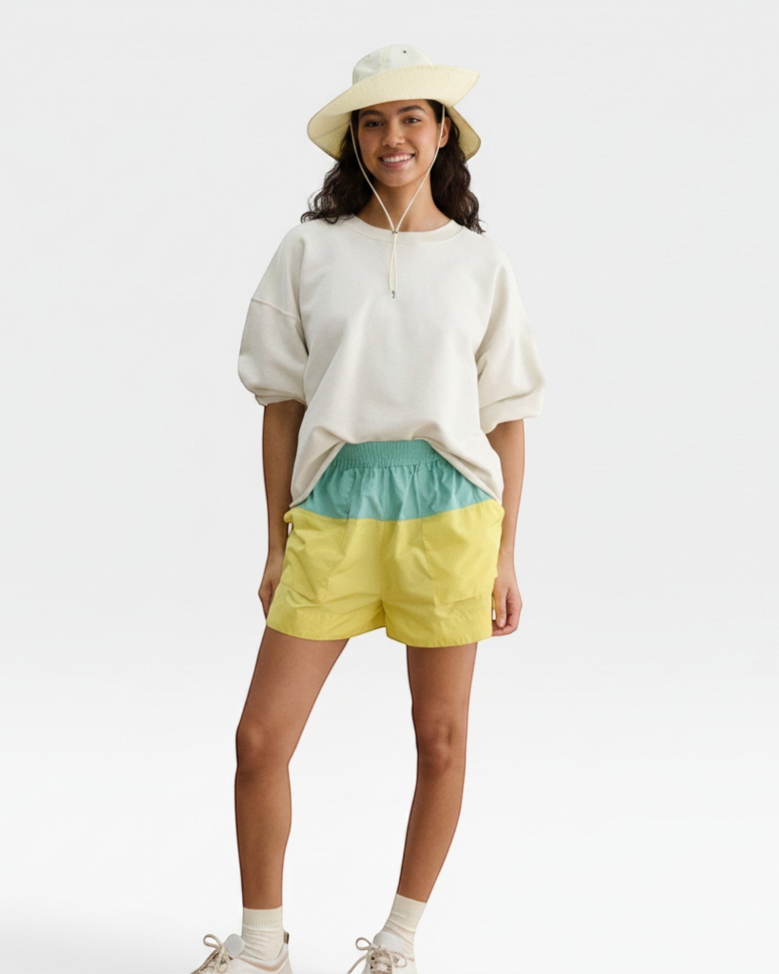 JONES + CO Skipper Hat in bone, a packable sun hat made of 100% nylon with a wide brim and chin strap.