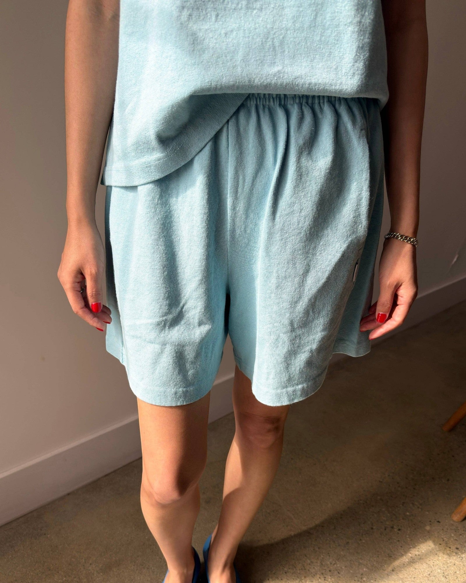 JONES + CO sky blue heavy weight 100% cotton flared basketball shorts with elastic waistband and mid-thigh length.