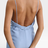 JONES + CO sky blue Priss dress featuring a low-cut back, slim straps, and draped neckline detail.