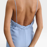 JONES + CO sky blue Priss dress featuring a low-cut back, slim straps, and draped neckline detail.