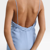 JONES + CO sky blue Priss dress featuring a low-cut back, slim straps, and draped neckline detail.