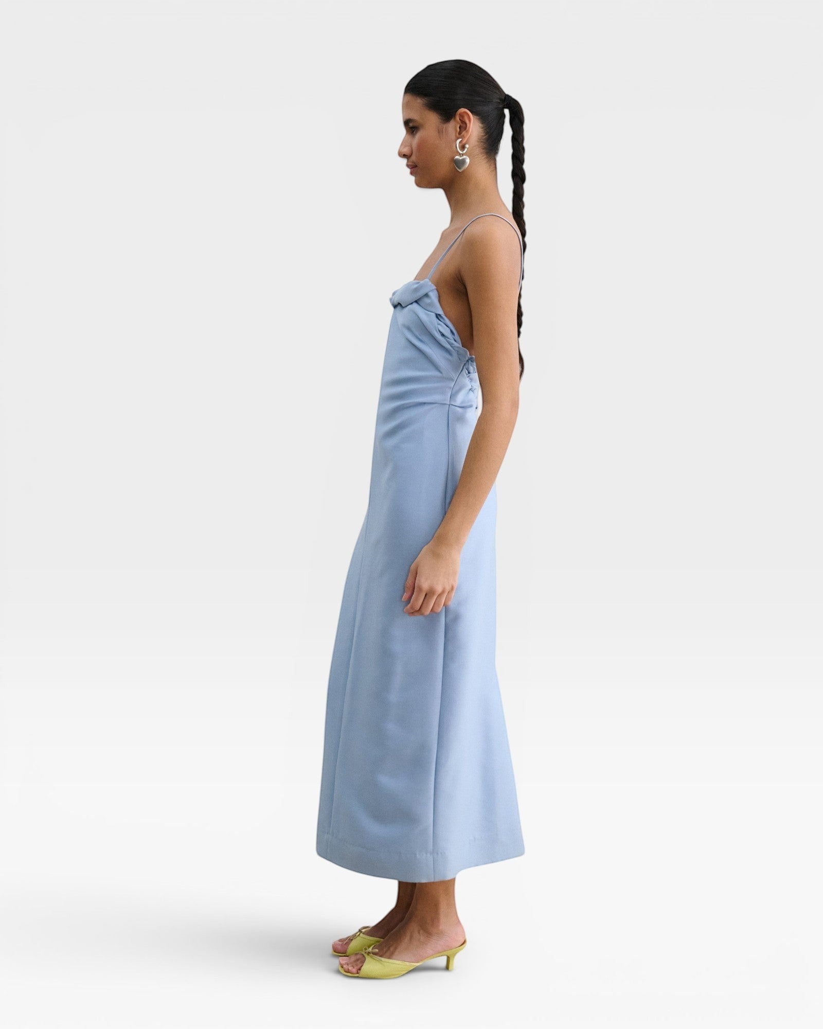 JONES + CO sky blue Manon wool midi dress with slim straps, draped neckline, and low-cut back on a model