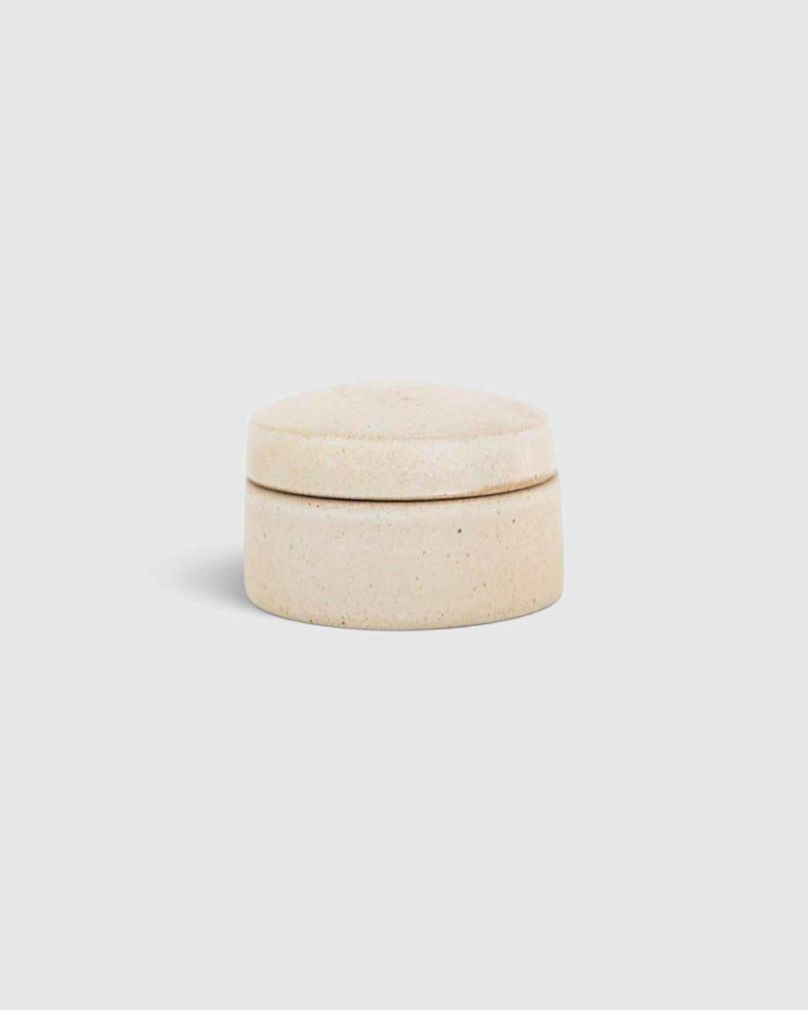 JONES + CO small handthrown ceramic jar in a neutral speckled finish with a matching lid.