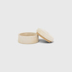 JONES + CO small handthrown ceramic jar in a neutral speckled finish with a matching lid on a white background