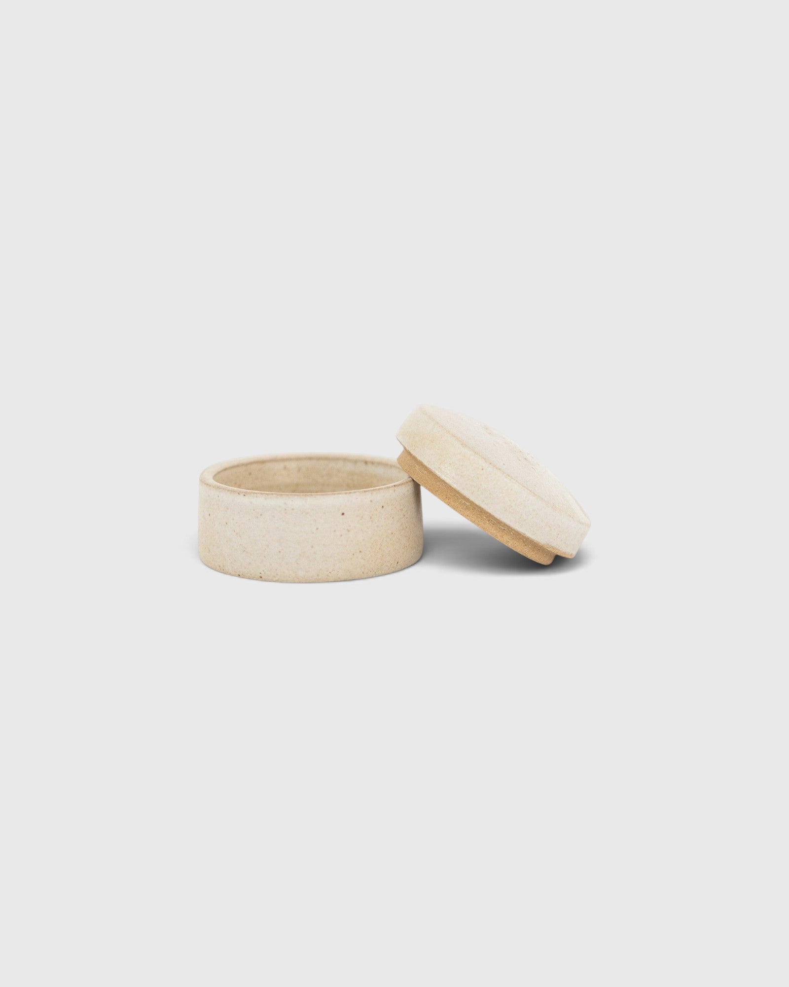 JONES + CO small handthrown ceramic jar in a neutral speckled finish with a matching lid on a white background