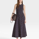 JONES + CO block print polka dot smocked maxi dress with a sleeveless tank top and tiered skirt.