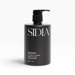 JONES + CO SOAKED The Cream hand and body lotion with Juniper, Cypress, and Musks. Black pump bottle.