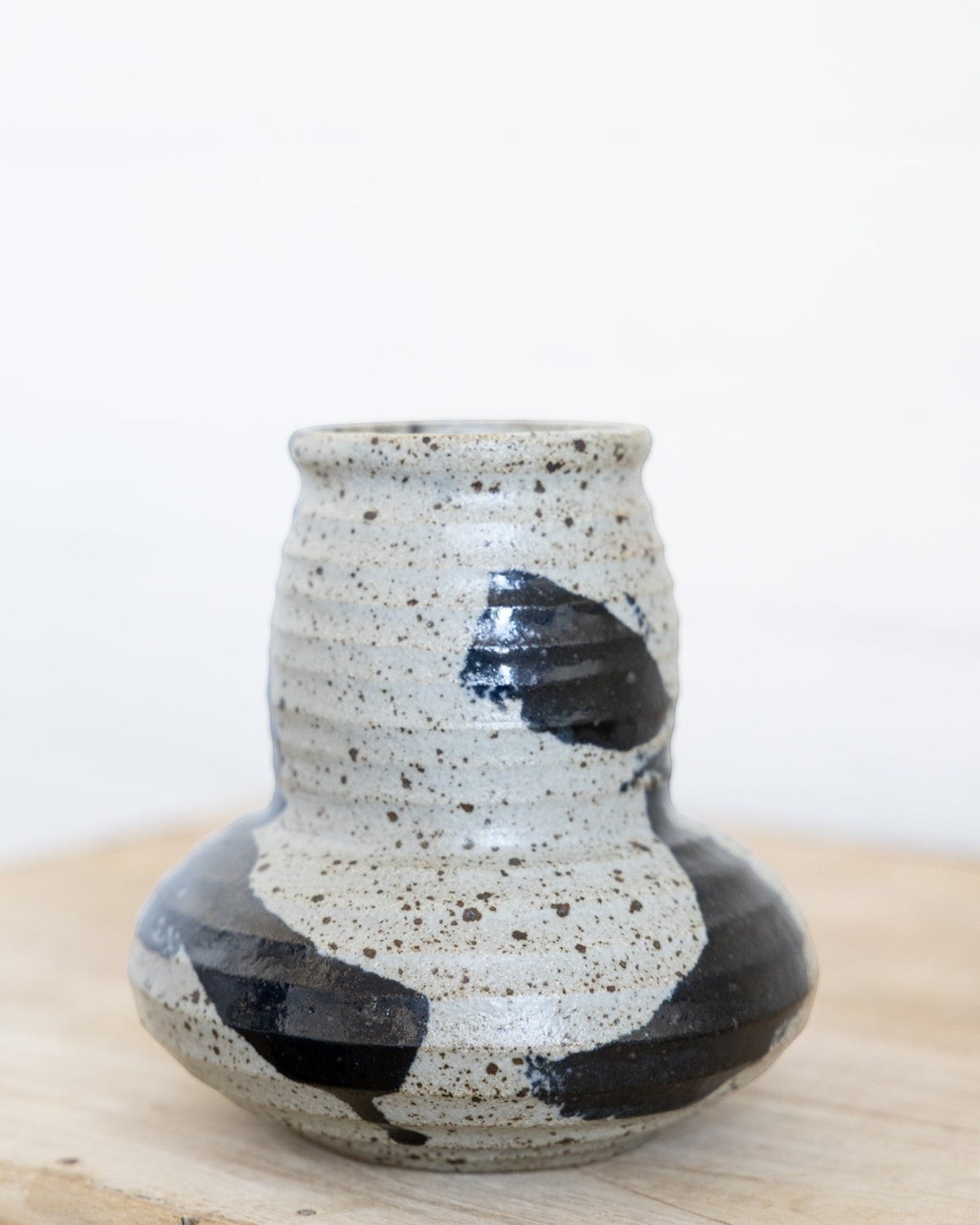 JONES + CO handmade ceramic vase with speckled off-white glaze and bold black brushwork.