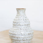 JONES + CO handmade speckled ceramic vessel with sculptural form and soft glaze.