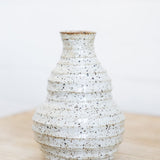 JONES + CO handmade speckled ceramic vessel with sculptural form and soft glaze.