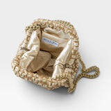 JONES + CO Stella Clutch in natural woven raffia with a satin lining and a tone-on-tone chain strap.