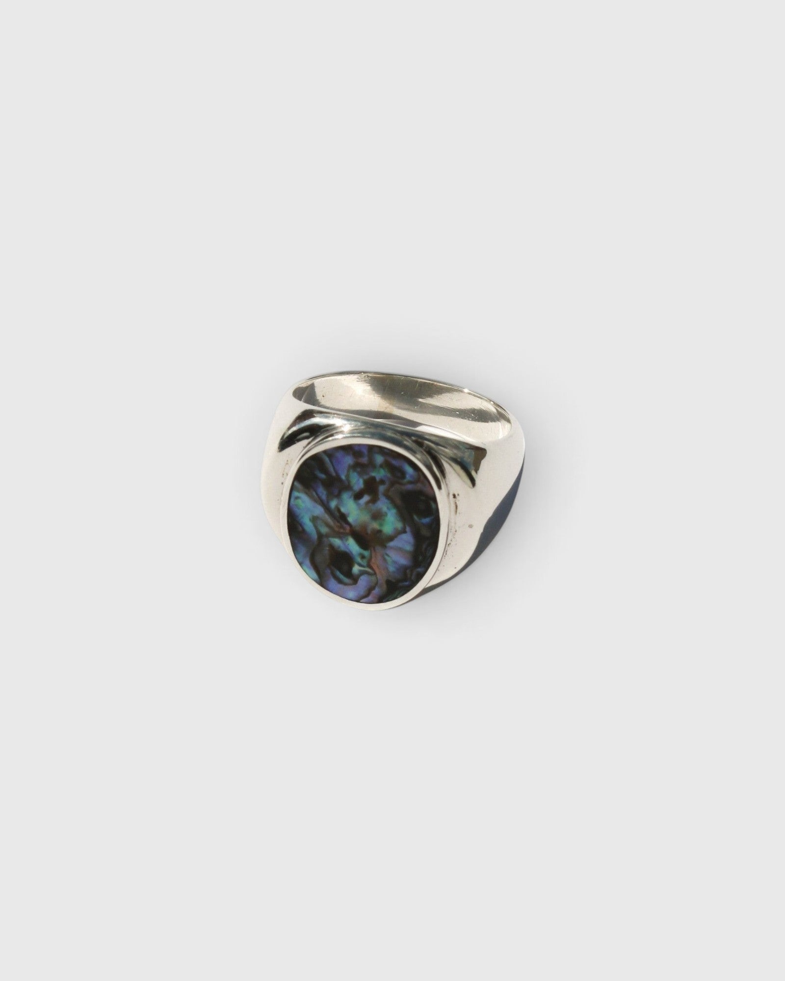 JONES + CO sterling silver statement ring featuring a unique iridescent blue abalone shell inlay