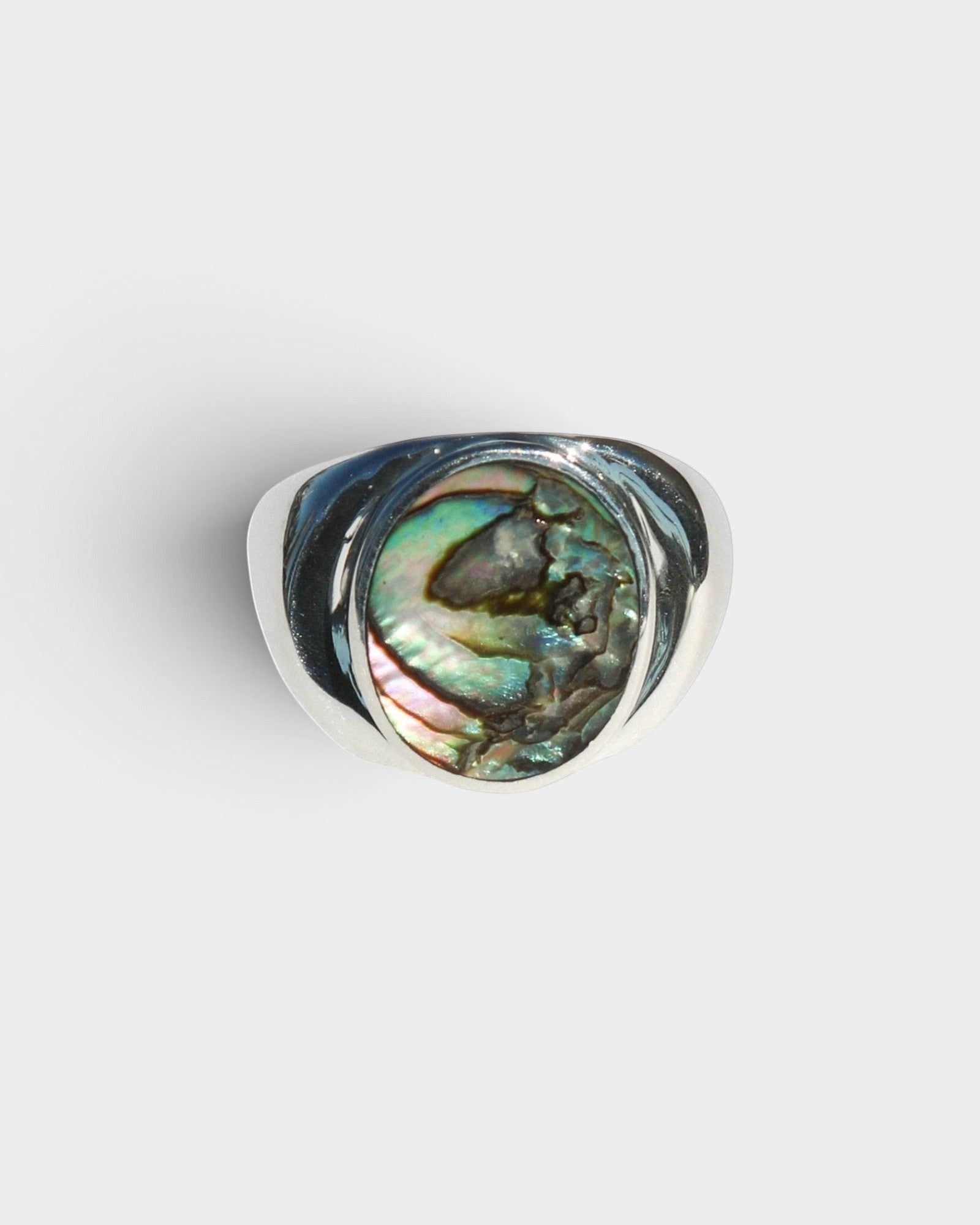 JONES + CO sterling silver statement ring featuring a unique iridescent blue abalone shell inlay, handmade in Mexico.