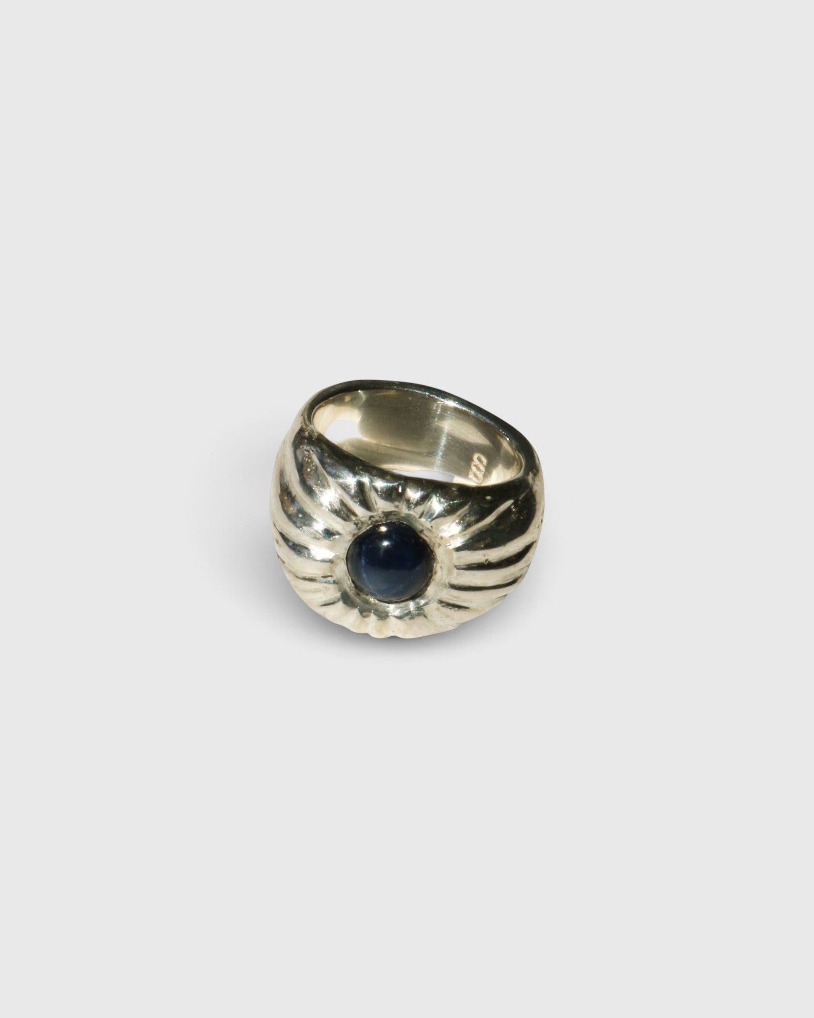 JONES + CO Dean ring in .925 sterling silver featuring a bold, sculptural design with a blue star sapphire center.
