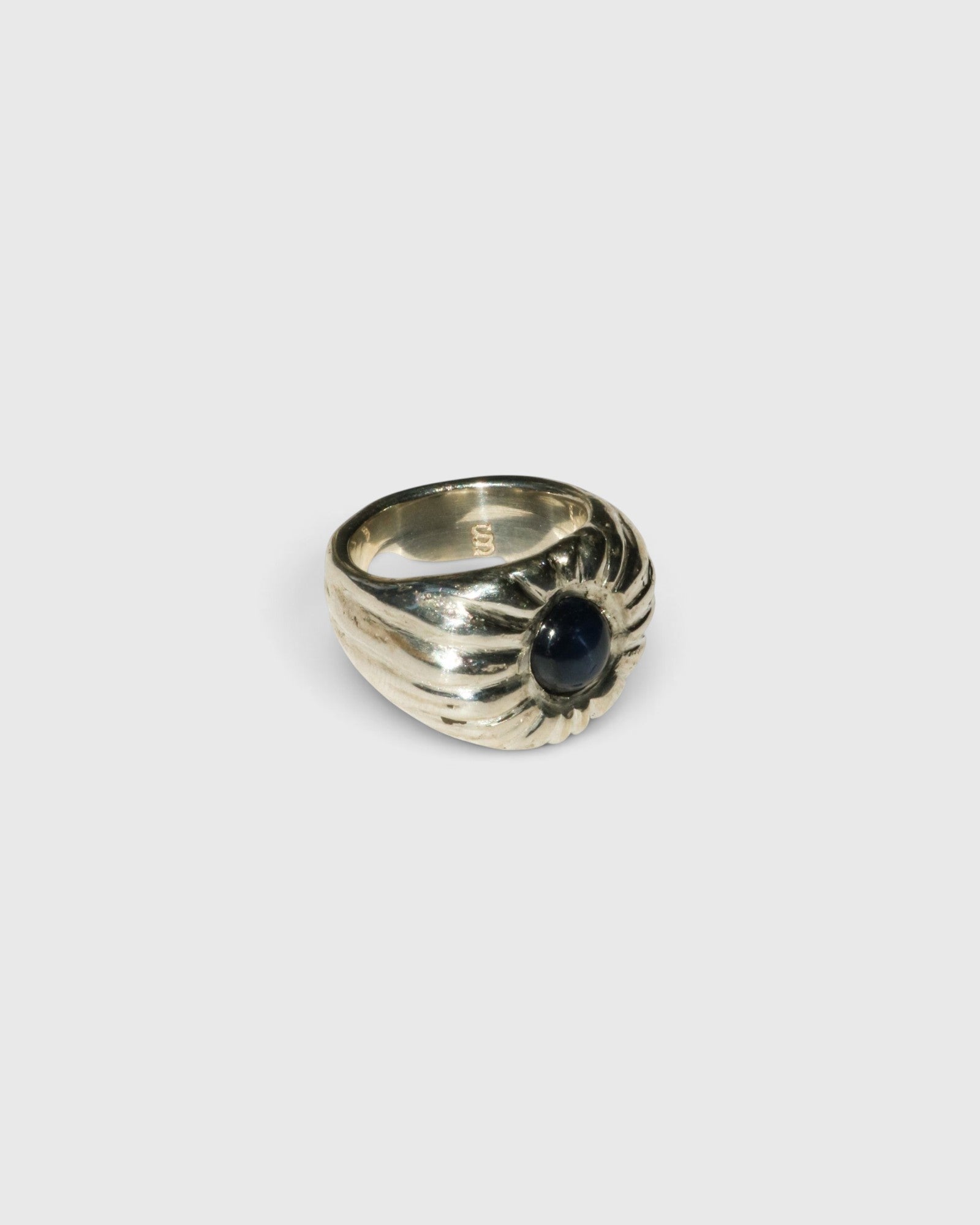 JONES + CO Dean ring in .925 sterling silver featuring a bold, sculptural design with a blue star sapphire center.
