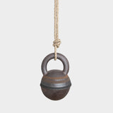 JONES + CO XS stoneware jingle bell with hand-painted black and brown rings, hanging from a natural hemp rope.