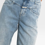 JONES + CO Stover-X relaxed light blue organic cotton denim jeans with signature X-pockets and cropped leg fit.