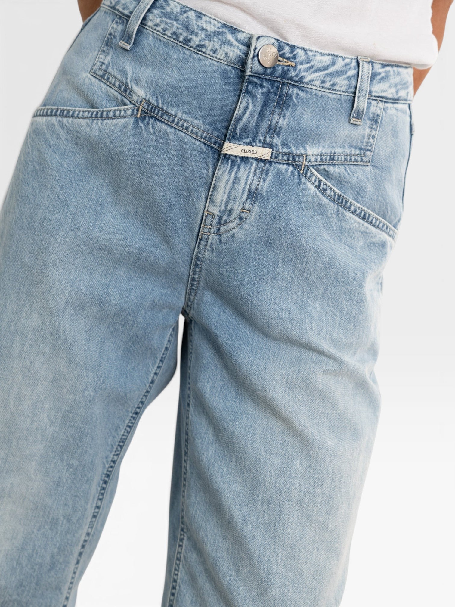 JONES + CO Stover-X relaxed light blue organic cotton denim jeans with signature X-pockets and cropped leg fit.