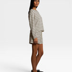 JONES + CO natural and chocolate striped loop terry shorts with elastic waistband worn by a model