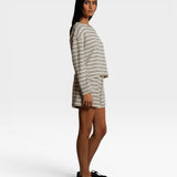 JONES + CO natural and chocolate striped loop terry shorts with elastic waistband worn by a model