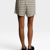 JONES + CO natural and chocolate striped loop terry sweatshorts with an elastic waistband, back view.
