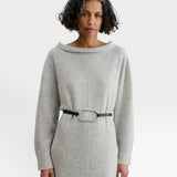 JONES + CO Studded Cole Belt in black leather with an oversized oval buckle worn over a grey knit dress