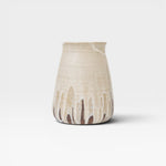 JONES + CO tall stoneware vase with a beige speckled glaze and dripping brown accents. Handthrown ceramic.