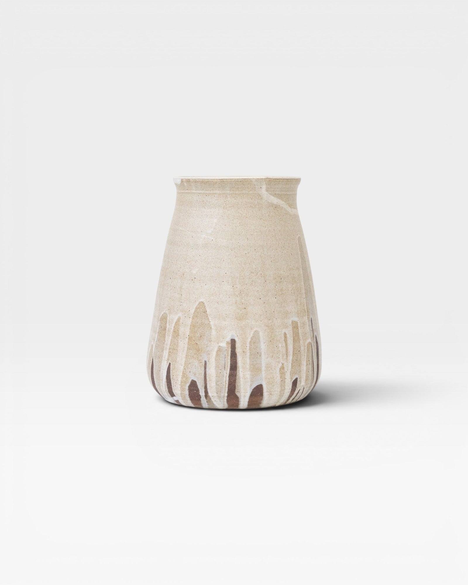 JONES + CO tall stoneware vase with a beige speckled glaze and dripping brown accents. Handthrown ceramic.