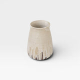 JONES + CO tall stoneware vase with a speckled cream glaze and a drip effect in brown at the base.