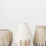 JONES + CO tall stoneware vase with a cream speckled glaze and brown drip detail. Handthrown ceramic.