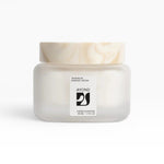 JONES + CO Taos Blue Barrier Cream, a lightweight, fast-absorbing facial moisturizer in a frosted glass jar with a marbled lid.
