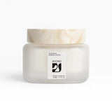 JONES + CO Taos Blue Barrier Cream, a lightweight, fast-absorbing facial moisturizer in a frosted glass jar with a marbled lid.