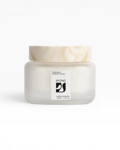 JONES + CO Taos Blue Barrier Cream, a lightweight, fast-absorbing facial moisturizer in a frosted glass jar with a marbled lid.