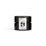 JONES + CO Taos Blue Barrier Cream in a small black jar, lightweight formula to hydrate and protect skin.