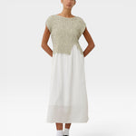 JONES + CO Toledo Top in marble ecru novelty yarn. Sleeveless, relaxed fit with an open front hem detail. Seamless 3D knit.