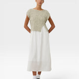 JONES + CO Toledo Top in marble ecru novelty yarn. Sleeveless, relaxed fit with an open front hem detail. Seamless 3D knit.