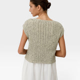 JONES + CO Toledo Top in ecru and black novelty yarn. Relaxed, sleeveless knit with seamless construction and open front hem detail.
